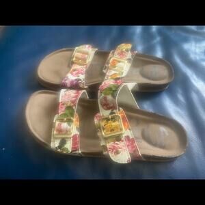 Madpaw buckle slides. Floral pattern on white.